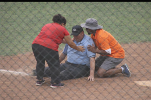 Umpire down from heat exhustion.